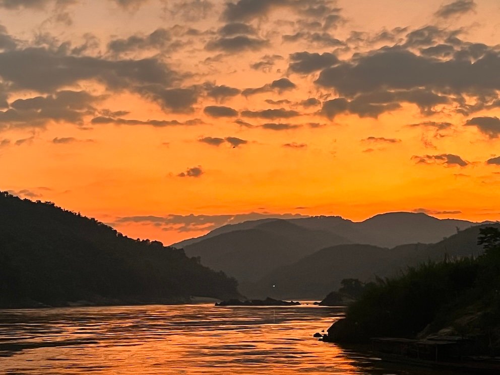 slow boat thailand laos - sunset